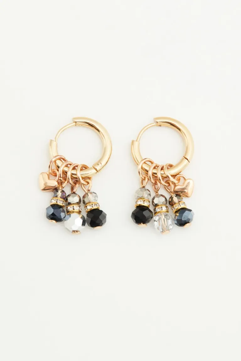 Aros de argolla con piedras facetadas y mini dije de corazón en acabado dorado de Rapsodia en Bijouterie para argentina