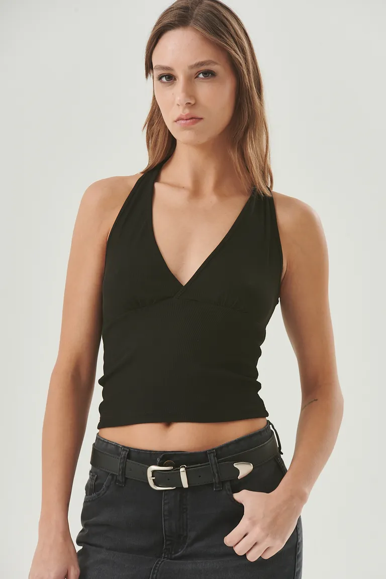 Top negro con escote halter cruzado y espalda abierta con tiras anudadas de Sweet en Tops para argentina