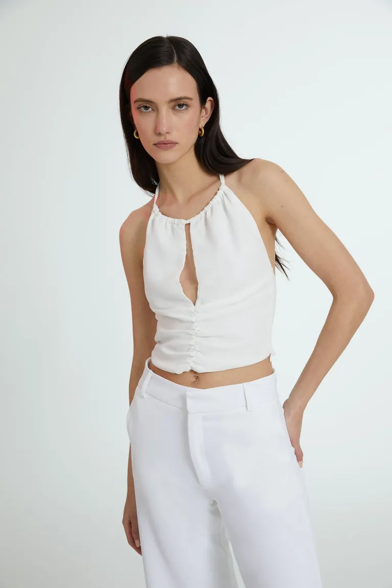 Top halter de diseño minimalista y elegante en color blanco de Naíma en Tops para argentina