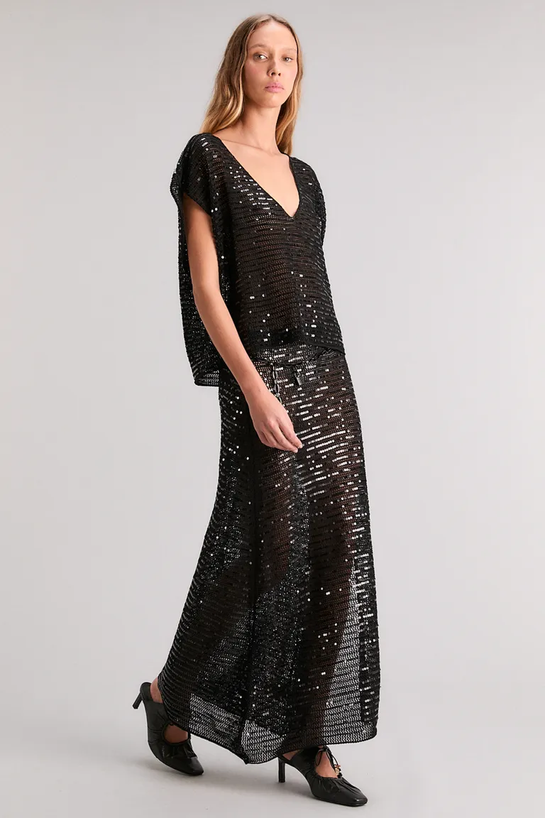 Falda midi con detalles de lentejuelas y tiro alto para un look elegante y brillante de Kosiuko en Faldas para argentina