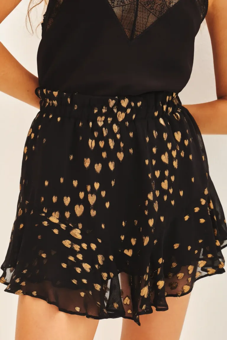 Falda corta de viscosa con estampado jacquard lurex en diseño amplio y volados de Rapsodia en Faldas para argentina