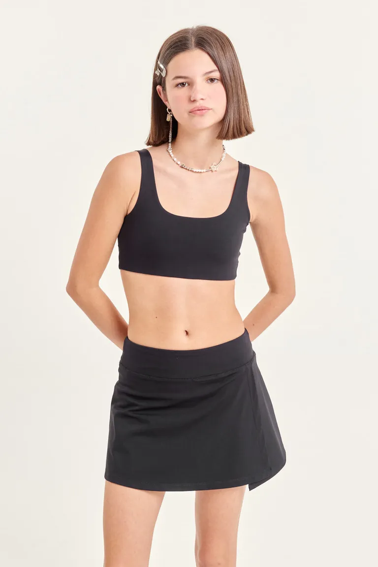 Top deportivo elástico y de alta sujeción para mujer de 47 Street en Tops para argentina