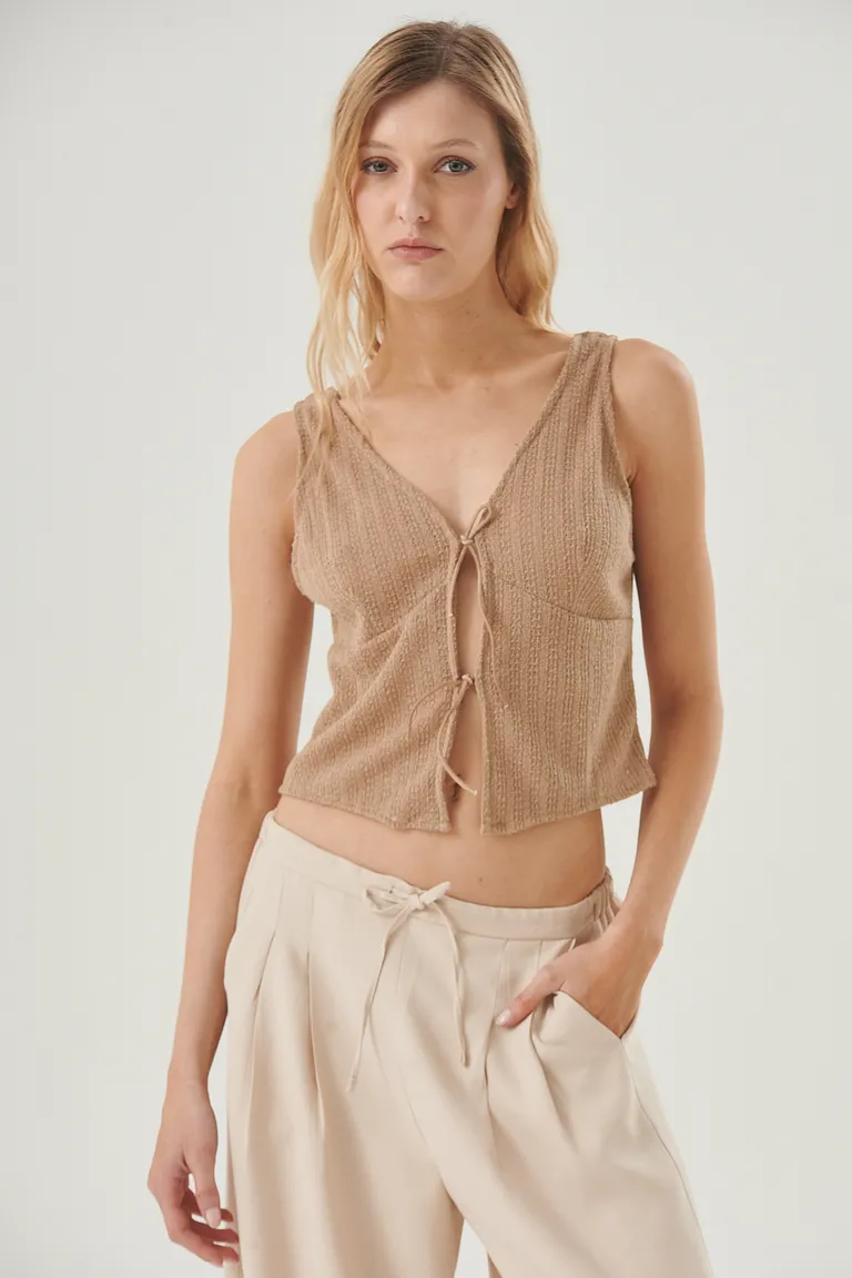 Top sin mangas con escote en V y lazos delanteros para un look fresco y elegante de Sweet en Tops para argentina
