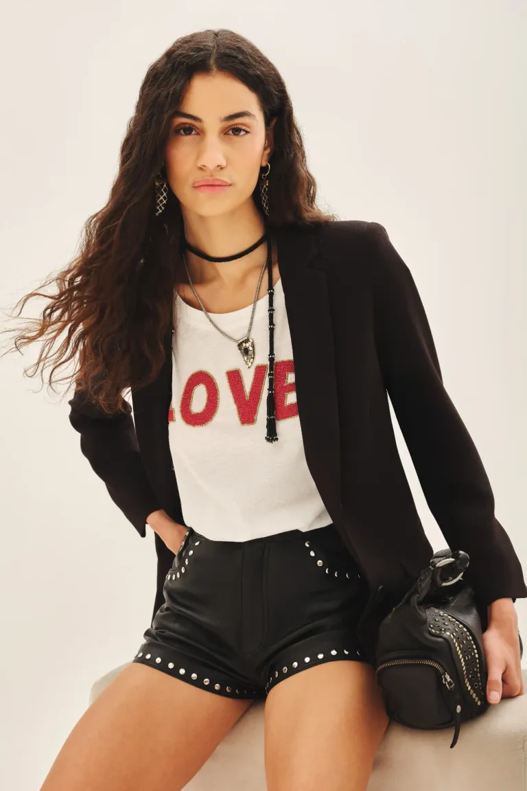 Remera confeccionada en tela flamé con bordado de logo en la espalda de Rapsodia en Remeras para argentina