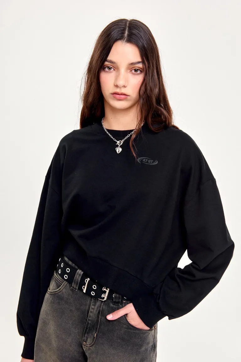 Buzo negro de frisa liviana y diseño minimalista para mujer de 47 Street en Buzos y Sweaters para argentina