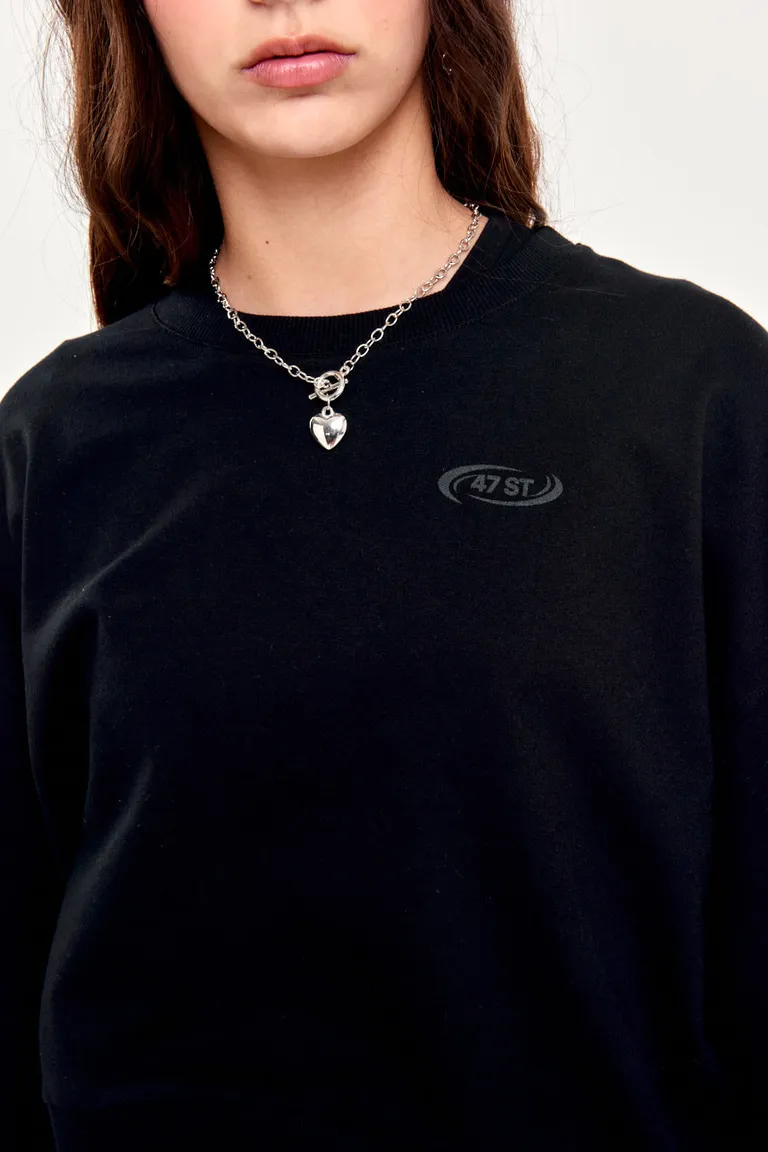 Buzo negro de frisa liviana y diseño minimalista para mujer de 47 Street en Buzos y Sweaters para argentina