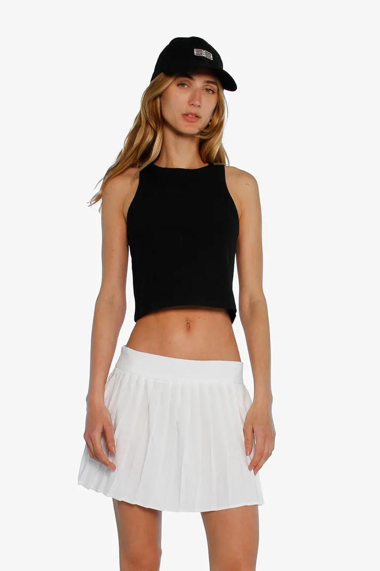 Falda plisada de tenis blanca, con cierre invisible y largo modular de Sofia Sarkany en Faldas para argentina