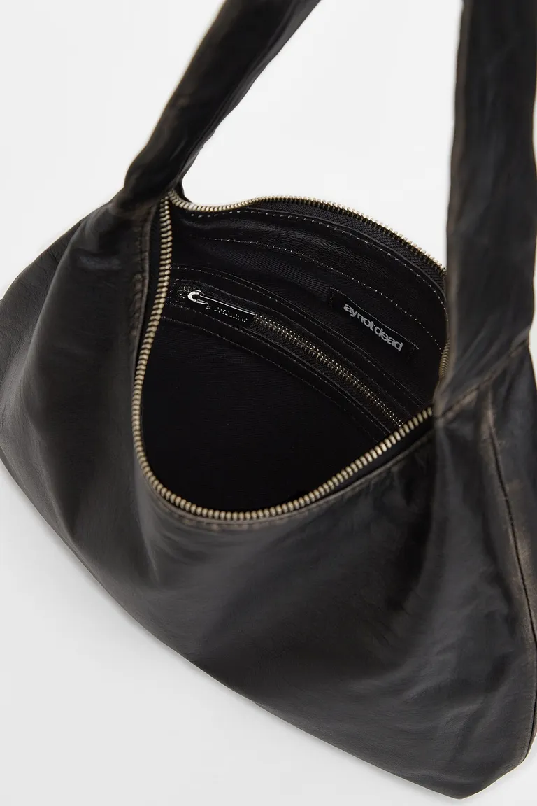 Cartera de cuero estilo vintage con cierre metálico en color negro de Ay Not Dead en Bolsos y Carteras para argentina
