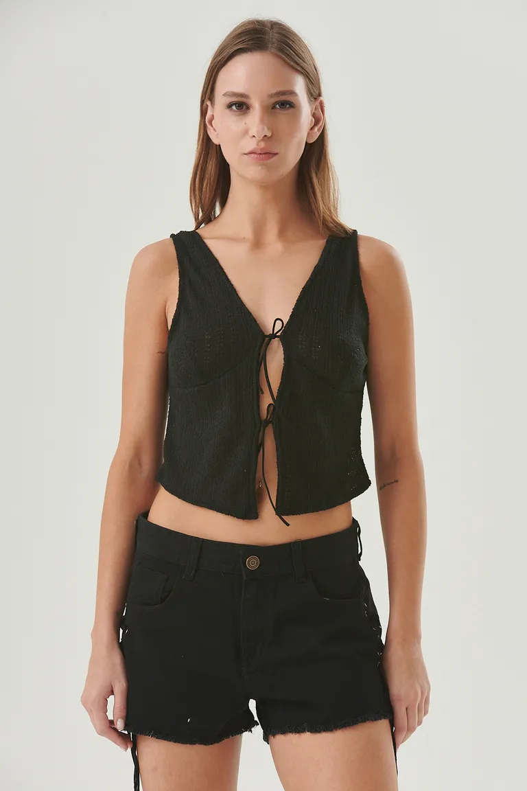 Top sin mangas con escote en V y lazos delanteros, ideal para un estilo natural y bohemio de Sweet en Tops para argentina