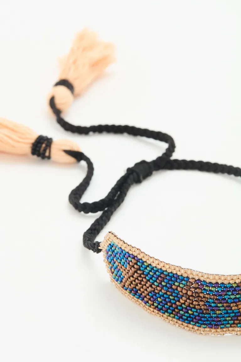 Pulsera regulable de mostacillas bordadas y borlas de hilo de Rapsodia en Bijouterie para argentina