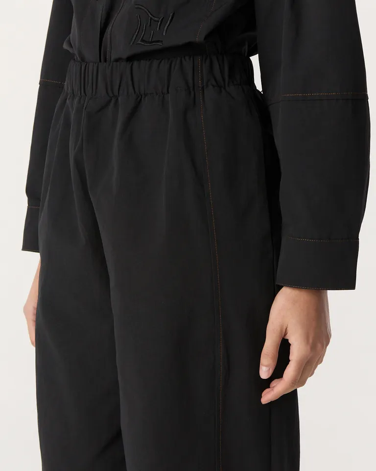 Pantalón de corte relajado con elástico en cintura, bolsillos laterales y recortes decorativos en piernas de Furzai en Pantalones para argentina