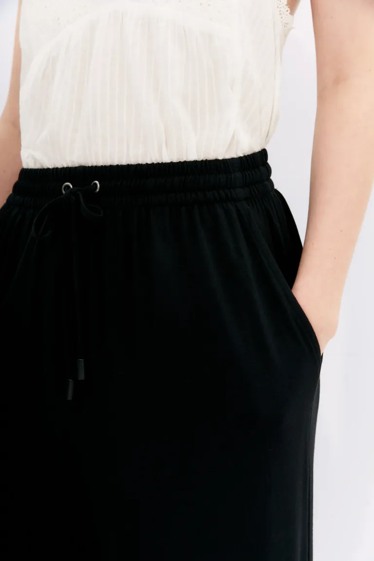 Pantalón palazzo negro con elástico y cordón en la cintura de Rapsodia en Pantalones para argentina