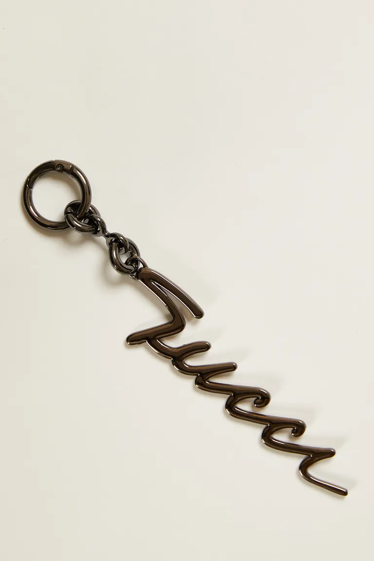 Llavero metálico con mosquetón y logo cursiva para llaves, carteras y jeans de Tucci en Llaveros para argentina