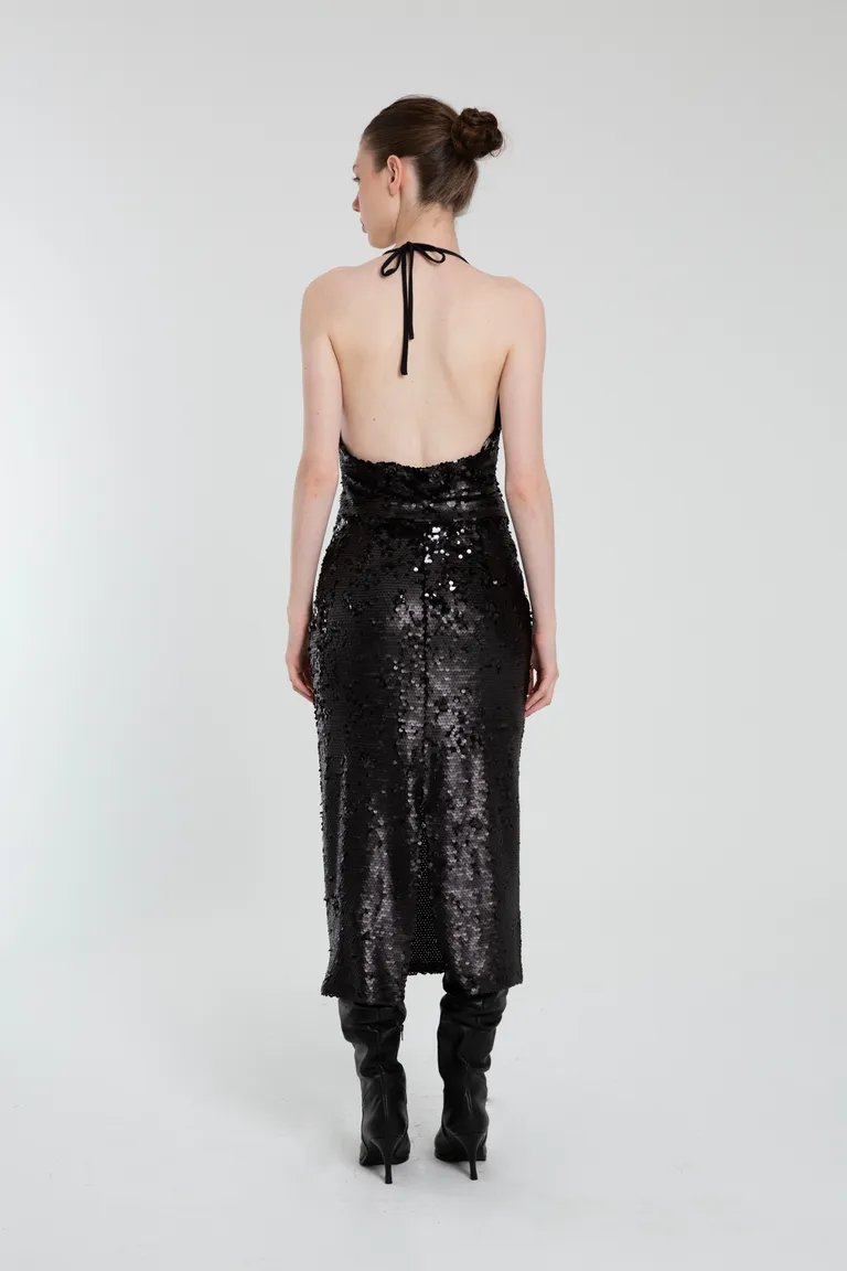 Falda de lentejuelas negra con tajo en la espalda y diseño modular de Naíma en Faldas para argentina