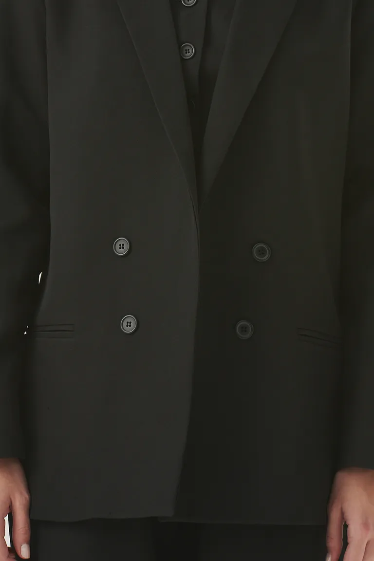 Elegante y atemporal blazer negro con doble abotonadura y solapas definidas de Sweet en Blazers para argentina