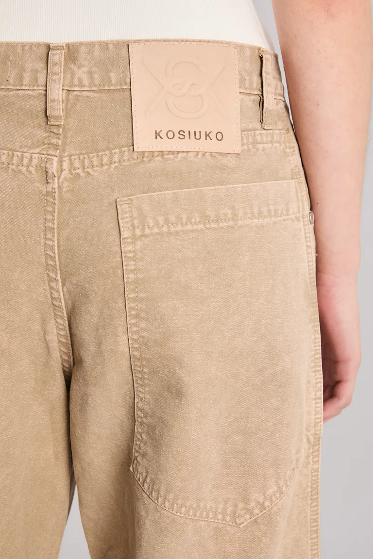 Pantalón de algodón con detalles de cierres en la bota, de corte relajado y tiro medio de Kosiuko en Pantalones para argentina