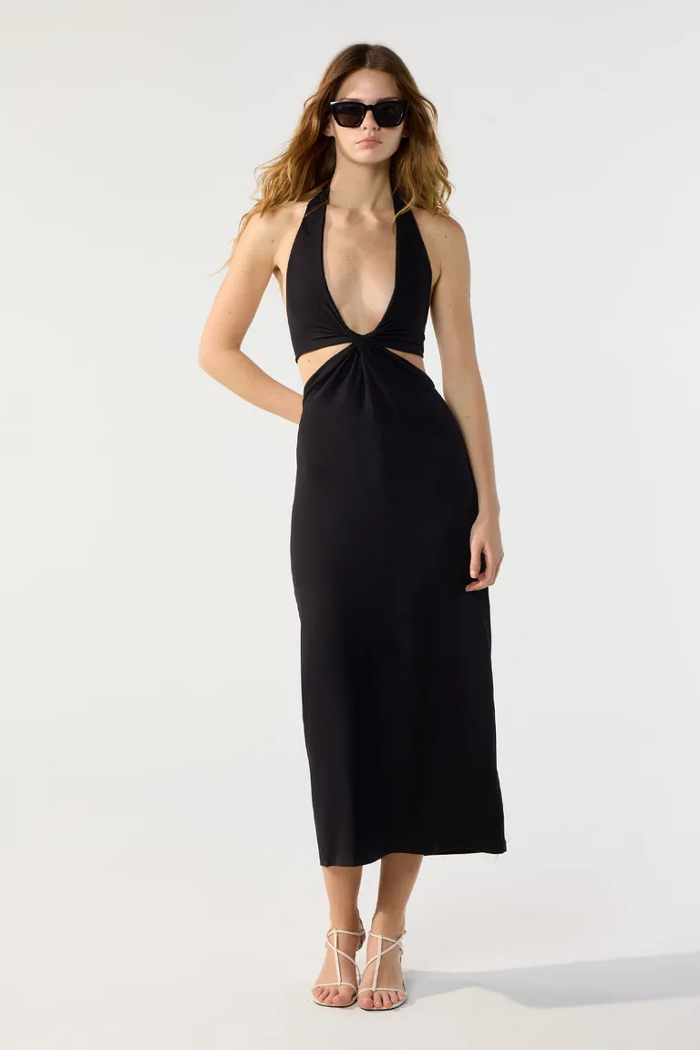 Vestido largo en jersey negro con escote cruzado y detalles en la cintura de Cuesta Blanca en Vestidos para argentina