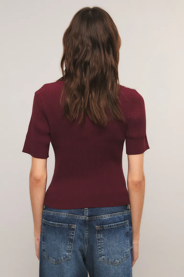 Top femenino de mangas cortas con cuello polo y botones en el frente de Kosiuko en Tops para argentina