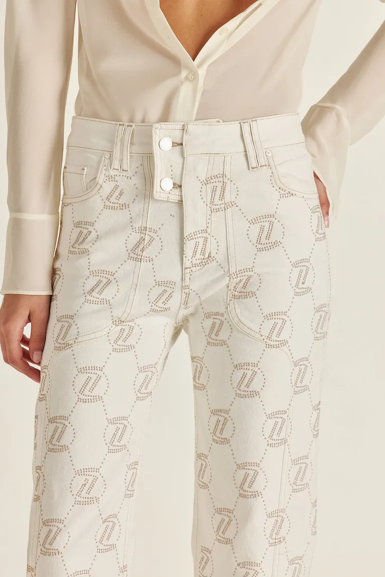 Pantalón de denim alto con diseño monogramado en tono dorado de Tucci en Pantalones para argentina