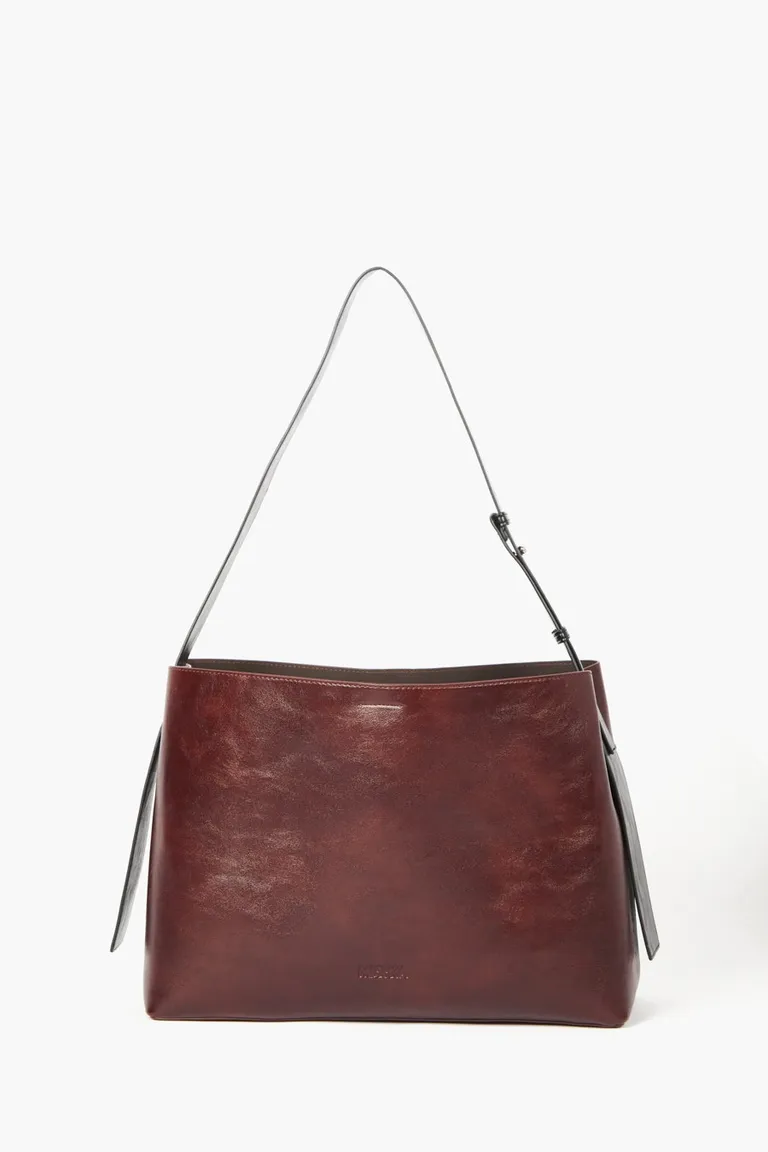 Bolso de mano con estructura semi rígida, correa larga regulable y necessaire interior extraíble de Mishka en Bolsos y Carteras para argentina