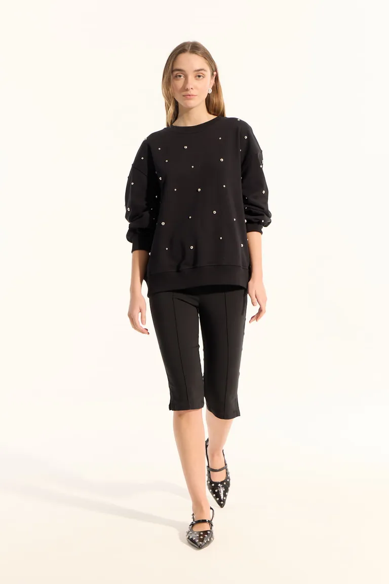 Buzo negro de algodón con borlas metálicas y calce holgado para mujer de Portsaid en Buzos y Sweaters para argentina