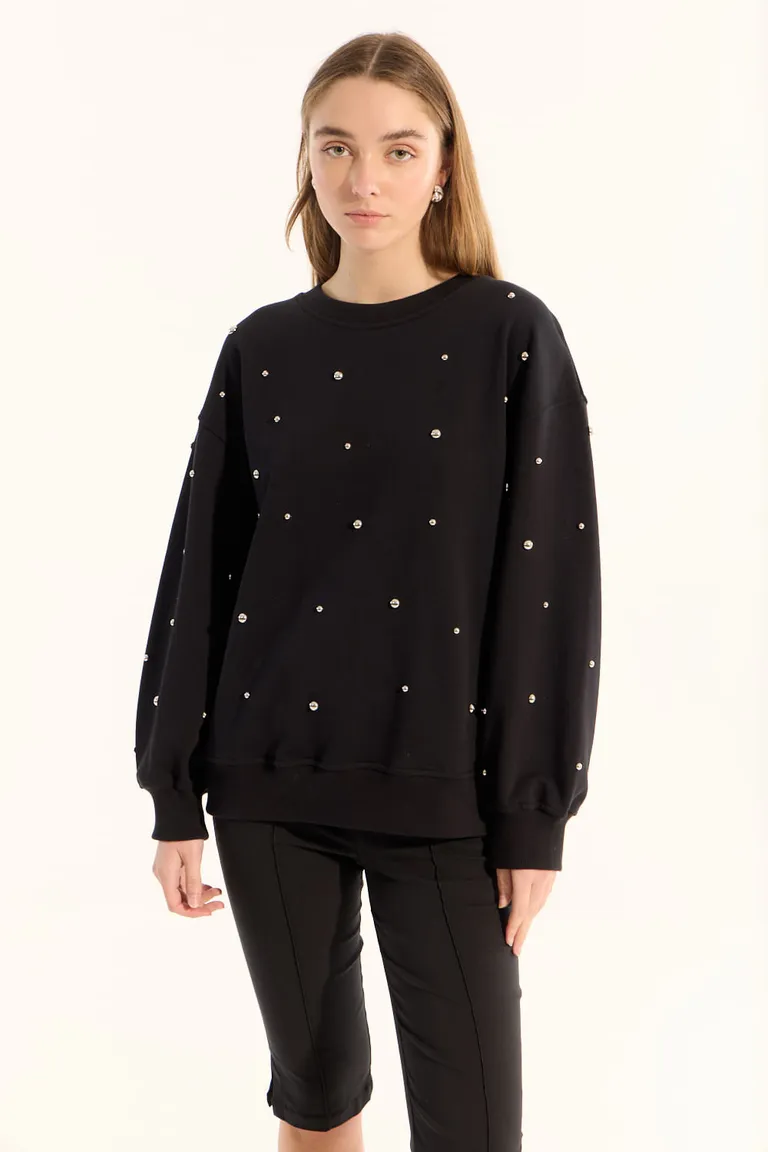 Buzo negro de algodón con borlas metálicas y calce holgado para mujer de Portsaid en Buzos y Sweaters para argentina