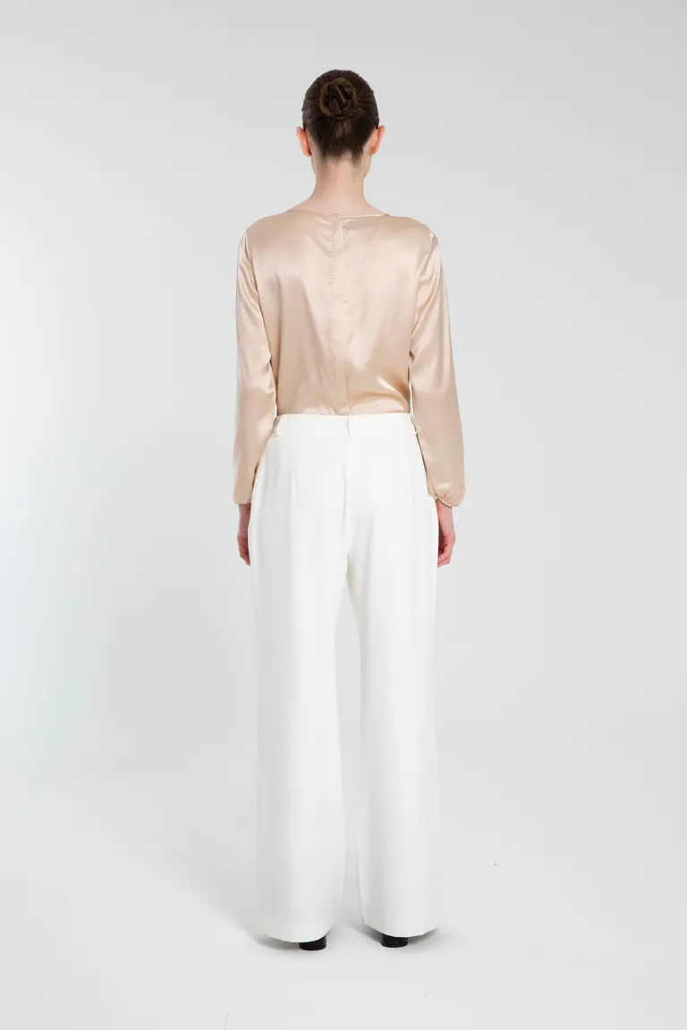 Pantalón de crepe blanco con cierre y presillas para un look elegante y moderno de Naíma en Pantalones para argentina