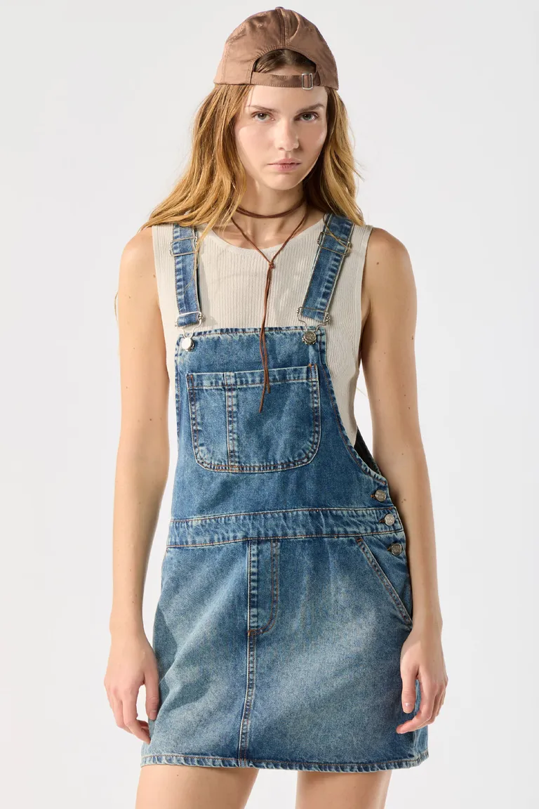 Mono de mezclilla azul con diseño de lavado desgastado y cierre frontal de hebillas de Cuesta Blanca en Monos para argentina