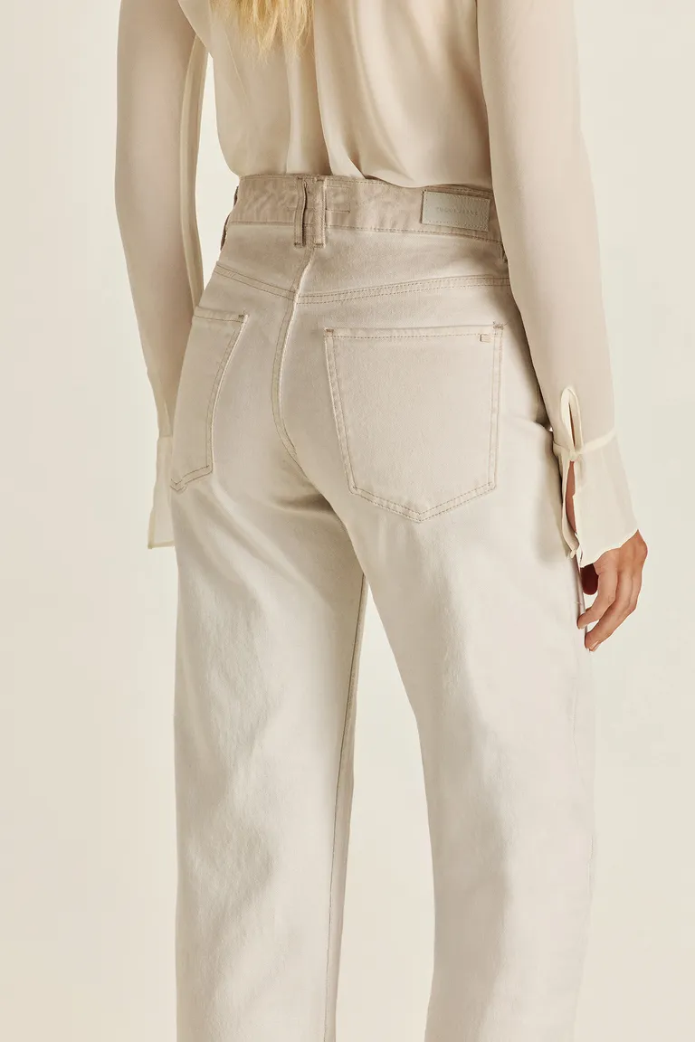 Pantalón de denim de tiro alto en color off white con acabado sucio y detalles exclusivos de Tucci en Pantalones para argentina