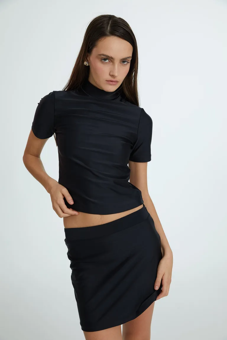 Falda corta y ajustada en tela de punto con cintura y cierre invisible lateral de Naíma en Faldas para argentina