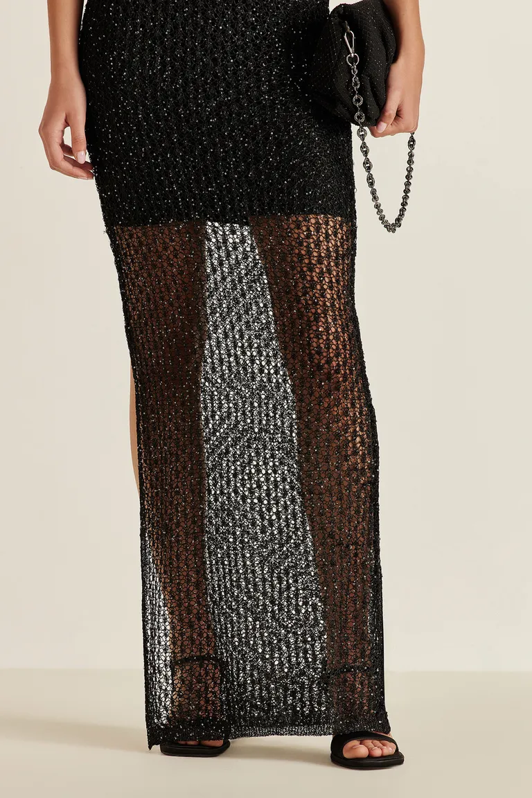 Vestido largo de tejido con lentejuelas y transparencias, escote pronunciado y silueta adherente de Tucci en Vestidos para argentina