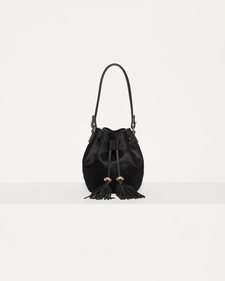 Micro bolso de mano en piel de becerro con cordón de cuero ajustable de Jazmin Chebar en Bolsos y Carteras para argentina