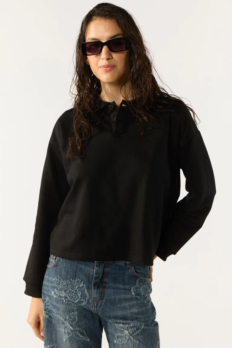 Buzo de diseño en tejido suave y cómodo en color negro de Cuesta Blanca en Buzos y Sweaters para argentina