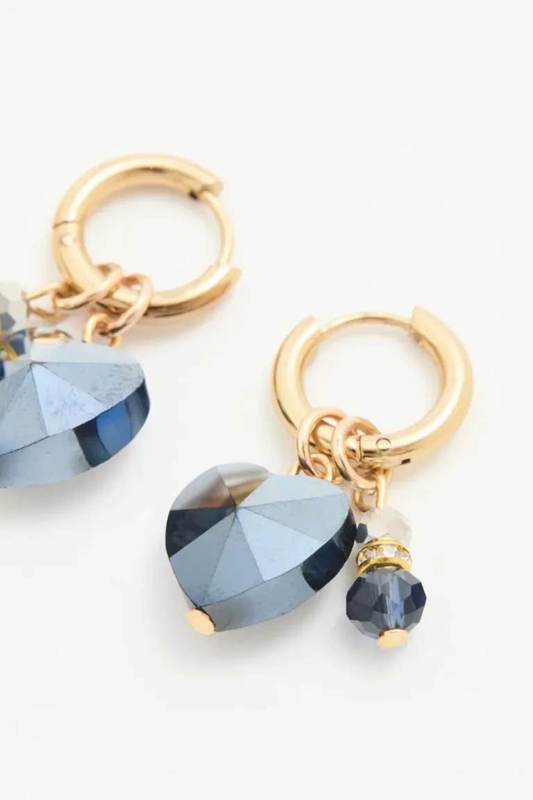 Aros argolla con dije de estrella facetado y piedras grises de Rapsodia en Bijouterie para argentina