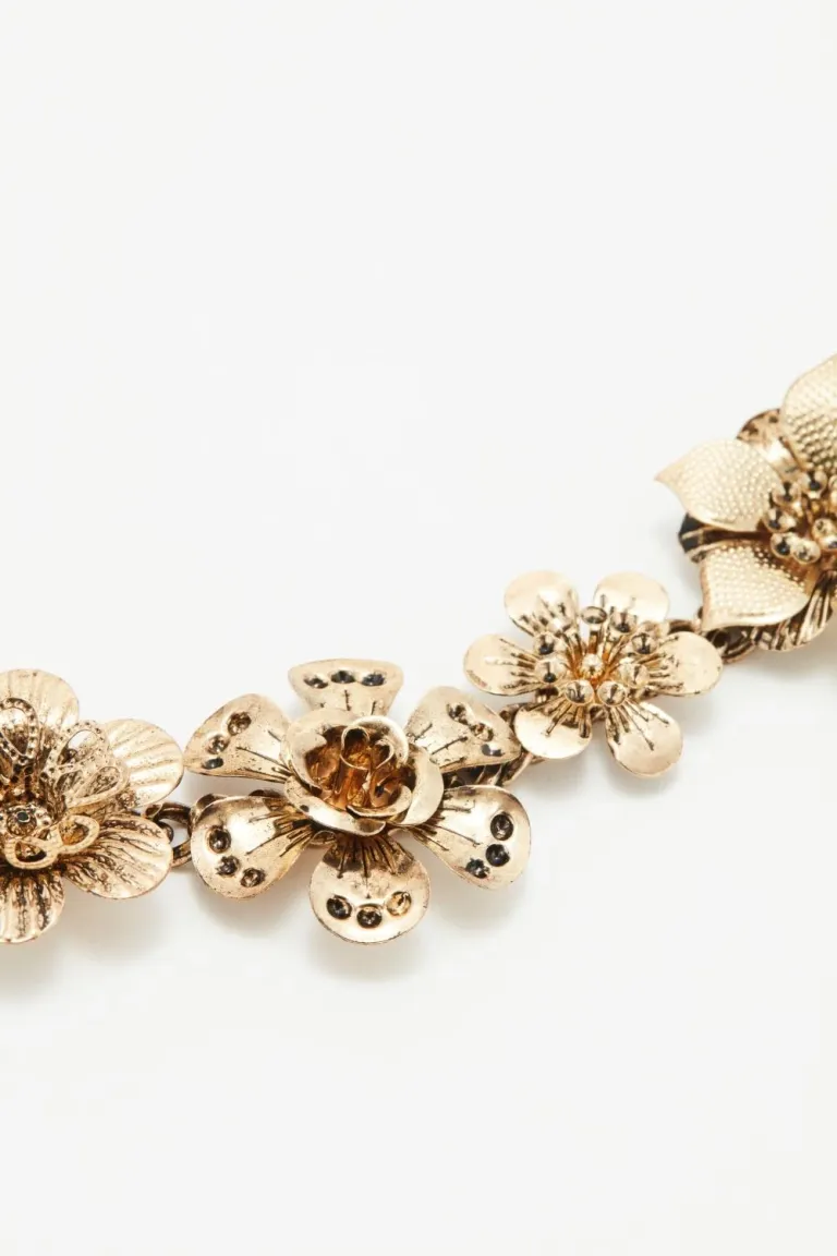 Cinturón ajustable de cadena con flores y eslabones decorativos de Rapsodia en Cinturones para argentina