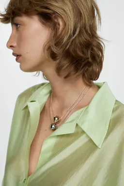 Camisa lyocell satinada de Mango en Camisas para argentina
