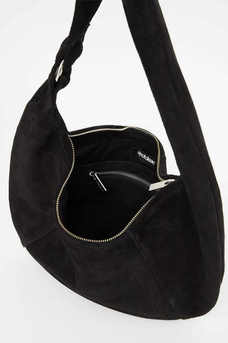 Cartera de gamuza negra de diseño redondeado con recortes y manija continua de Ay Not Dead en Bolsos y Carteras para argentina