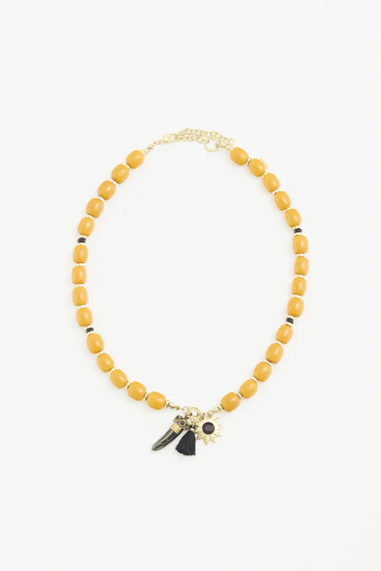 Collar artesanal con cuentas esféricas, dije de cuerno y borla decorativa de Rapsodia en Bijouterie para argentina