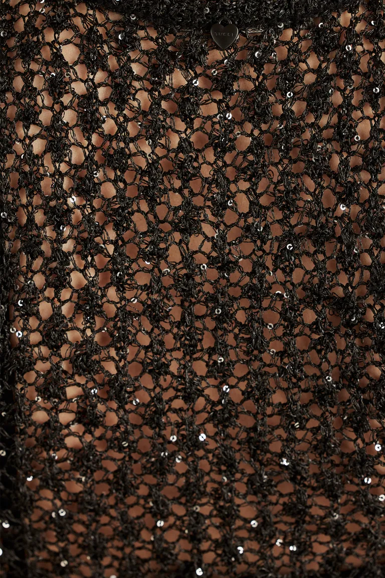 Top de noche con detalles de lentejuelas y escote pronunciado de Tucci en Tops para argentina