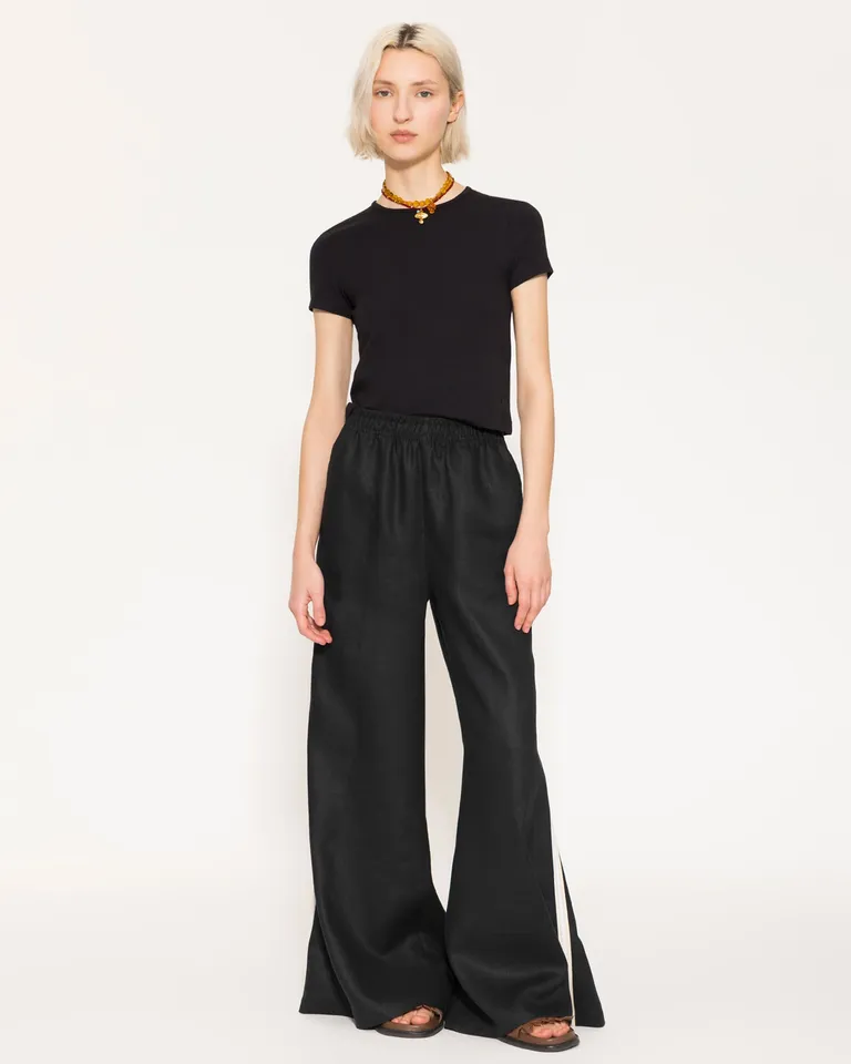 Pantalón wide leg de lino negro, con cintura elástica y bolsillos delanteros de Jazmin Chebar en Pantalones para argentina