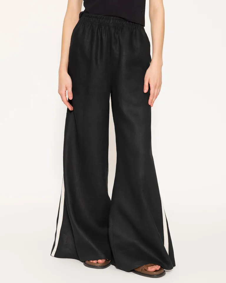 Pantalón wide leg de lino negro, con cintura elástica y bolsillos delanteros de Jazmin Chebar en Pantalones para argentina