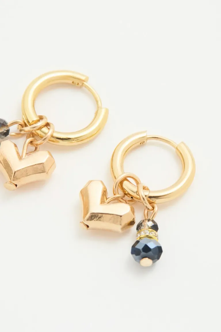 Hermosos aros de oro con corazón facetado y piedras brillantes de Rapsodia en Bijouterie para argentina
