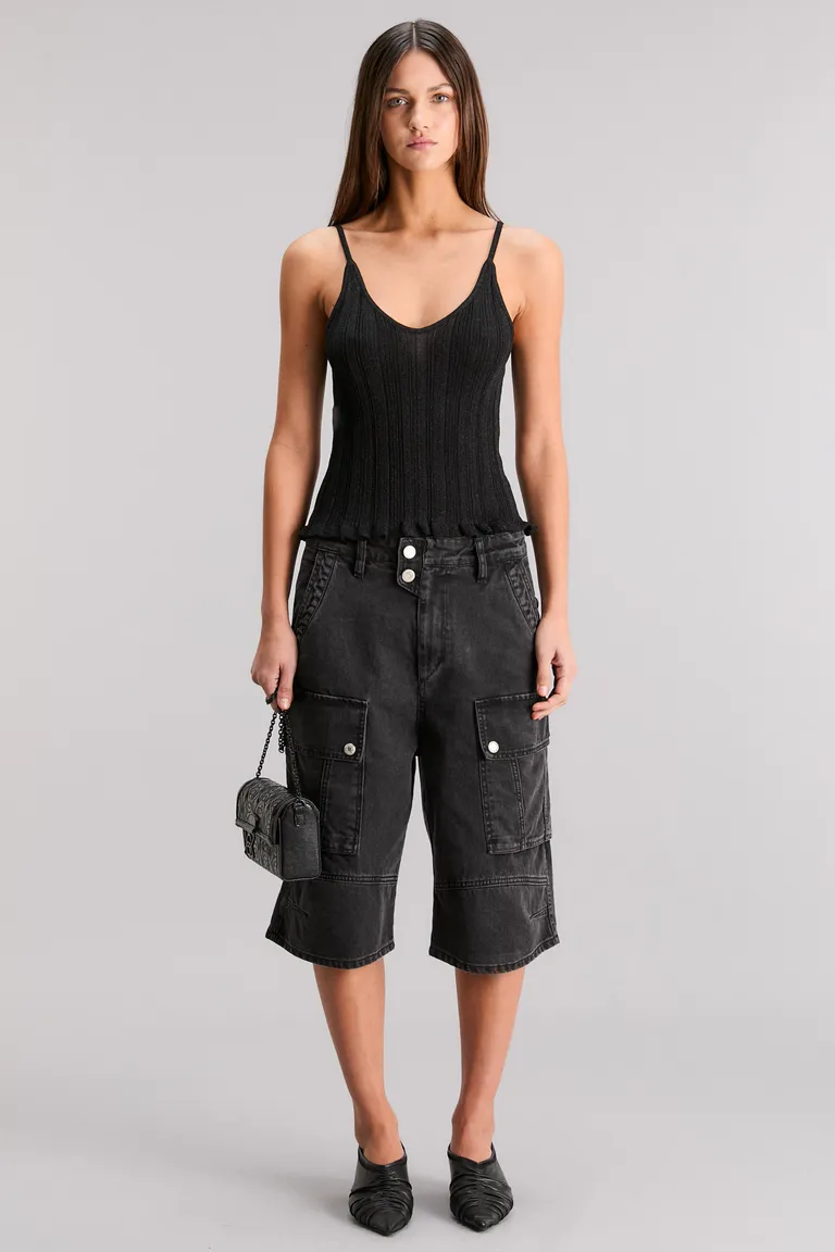 Top de escote en V en negro, con detalles tubulares y efecto transparente de Kosiuko en Tops para argentina
