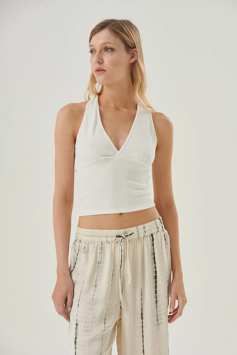 Top blanco halter cruzado con diseño de espalda descubierta y tiras anudadas de Sweet en Tops para argentina