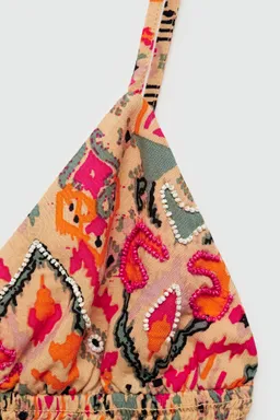 Top estampado con abalorios de Mango Teen en Tops para argentina