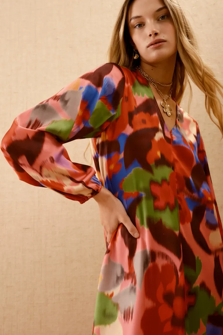 Elegante vestido largo estampado con escote profundo y mangas amplias de Rapsodia en Vestidos para argentina