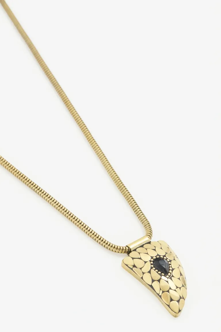 Collar de cadena dorada con dije de cuerno y piedra negra de Rapsodia en Bijouterie para argentina