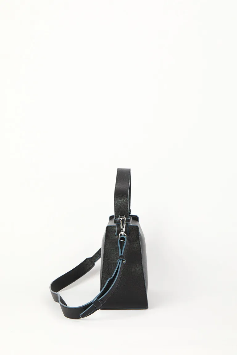 Cartera de mano y bandolera con correa regulable y desmontable de diseño rectangular de Mishka en Bolsos y Carteras para argentina