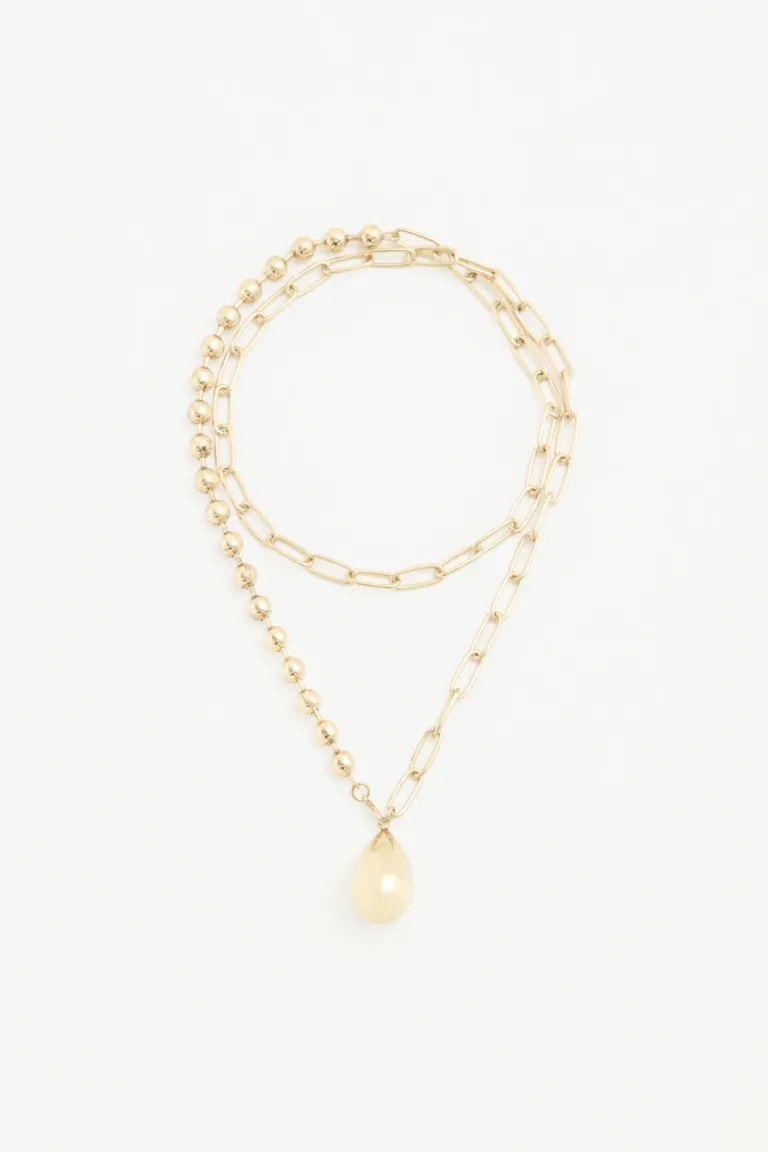 Collar de cadena y cuentas con dije de gota en tono dorado de Rapsodia en Bijouterie para argentina