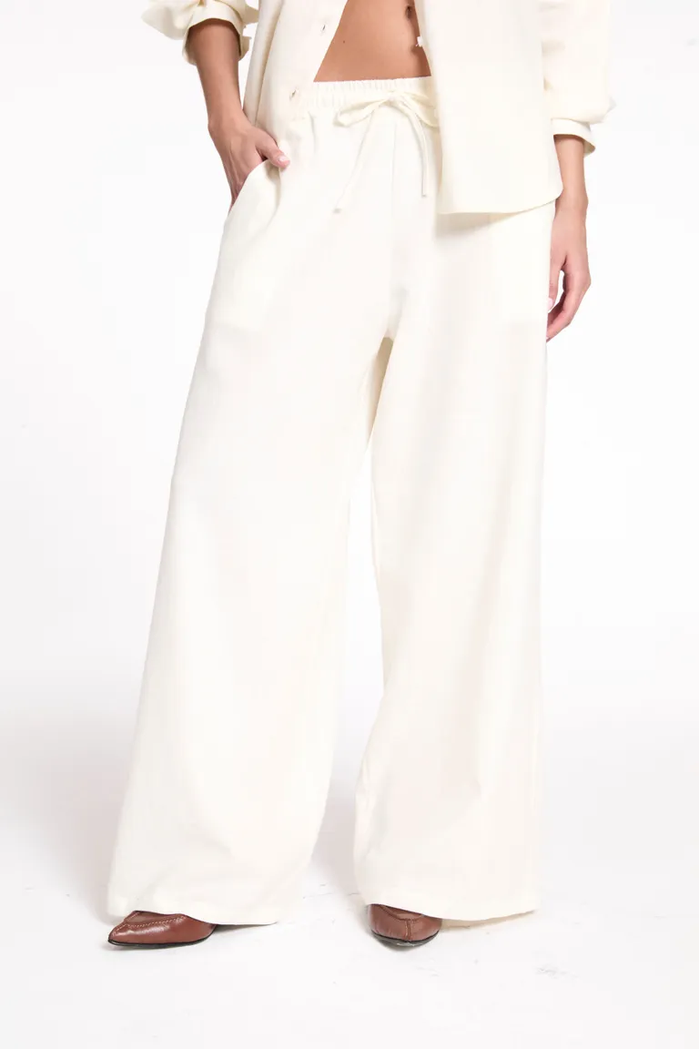 Pantalón de lino blanco con elástico en la cintura y bolsillos delanteros de Justaosadia en Pantalones para argentina